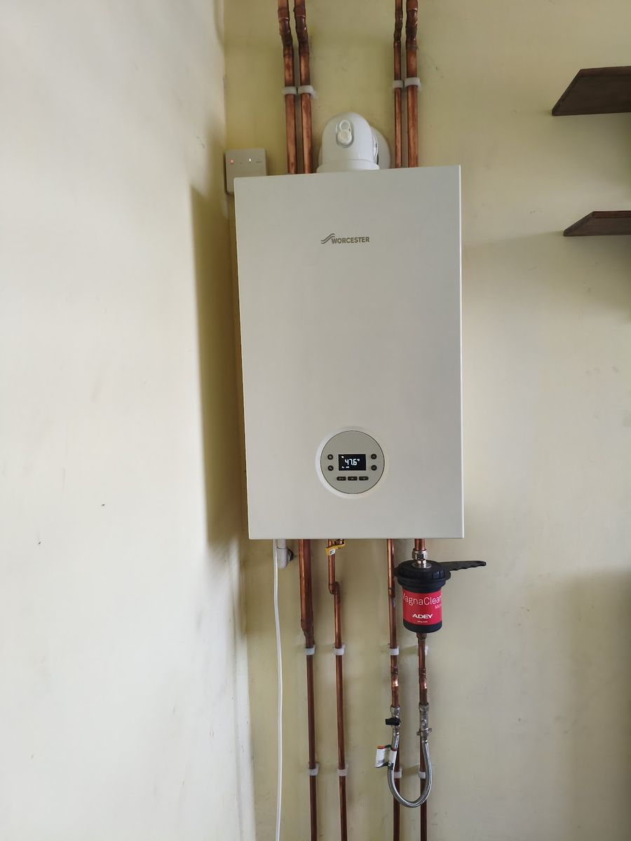 Worcester Bosch combi boiler installed with copper pipework and Adey MagnaClean filter